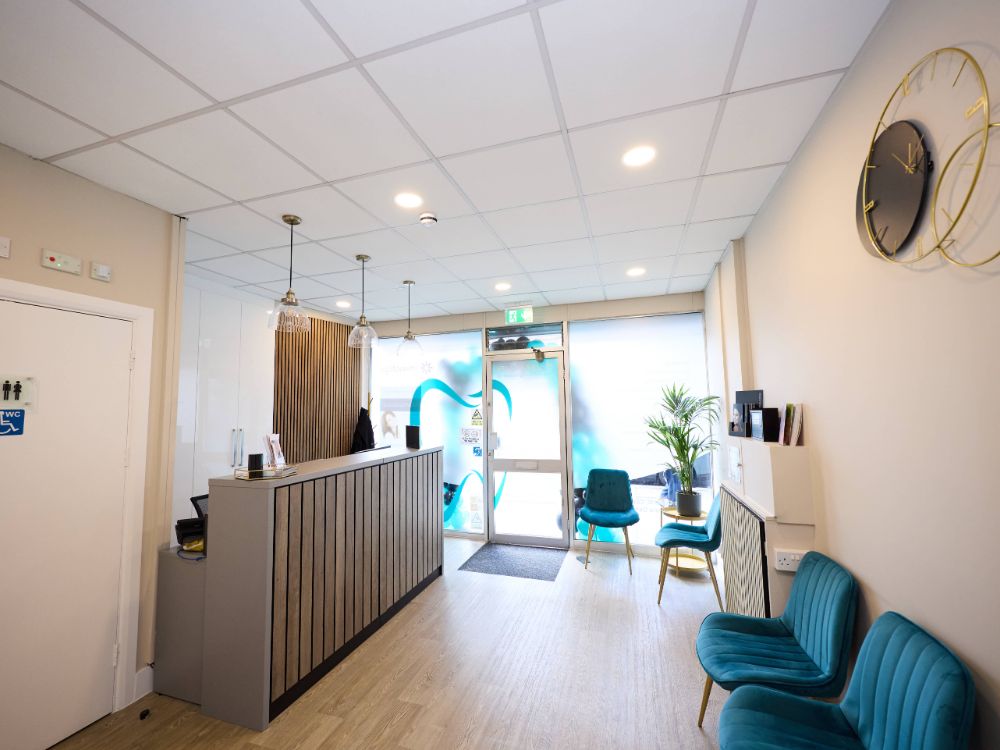Reception and waiting area with teal seating